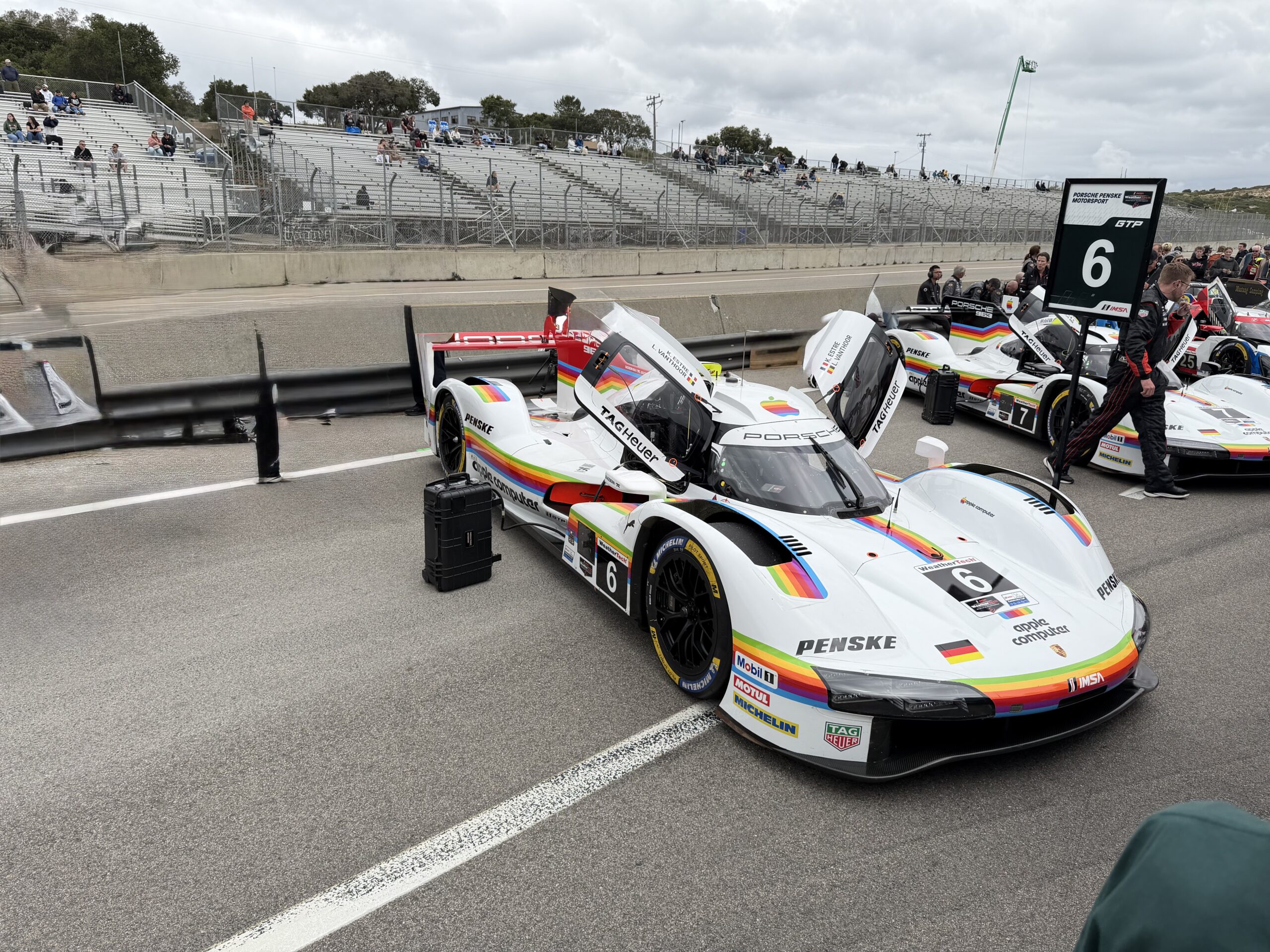Deeply AI edited image of a Porsche race car at Laguna Seca IMSA race